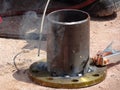 Construction workers welding pipes at the construction site. Royalty Free Stock Photo