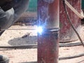 Construction workers welding pipes at the construction site. Royalty Free Stock Photo