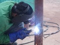 Construction workers welding pipes at the construction site. Royalty Free Stock Photo