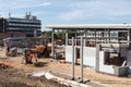 Construction workers working on building site with idustrial units Royalty Free Stock Photo