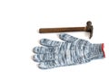 Construction working gloves and hammer on white background Royalty Free Stock Photo