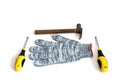 Construction working gloves and hammer on white background Royalty Free Stock Photo