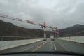 Construction works on a highway. Heavy machinery on the road, cranes building highway Royalty Free Stock Photo