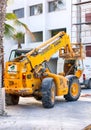 Construction works. JCB Telescopic Handler working near new building on the Paphos street