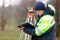 Construction works with tacheometer theodolite Royalty Free Stock Photo