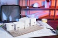 constructions models near blueprint on desk Royalty Free Stock Photo