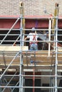 Constructionworker busy with the renovation of a building Royalty Free Stock Photo