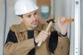 Constructon worker using hammer and chisel Royalty Free Stock Photo
