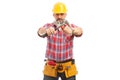 Constructor holding crossed hammer and wrench