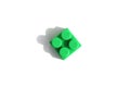 one green little brick, detail, on a white isolated background of their constructor set Royalty Free Stock Photo