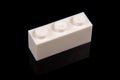 Constructor toy plastic brick close up isolated on the black