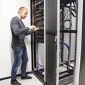 IT consultant building network rack in datacenter Royalty Free Stock Photo