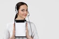 Consultant of call center in headphones holding clipboard Royalty Free Stock Photo