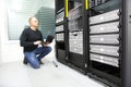 It consultant monitors servers in datacenter Royalty Free Stock Photo
