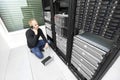 IT consultant solving problem with support in datacenter Royalty Free Stock Photo