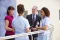 Consultants Meeting With Nurses Using Digital Tablet Royalty Free Stock Photo