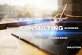 Consulting business concept. Text and icons on virtual screen. Royalty Free Stock Photo