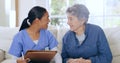 Consulting, home and nurse with senior woman on sofa for medical care, support and service. Healthcare, retirement and Royalty Free Stock Photo