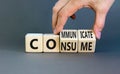 Consume or communicate symbol. Concept word Consume or Communicate on wooden cubes. Beautiful grey table grey background. Royalty Free Stock Photo