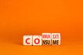 Consume or communicate symbol. Concept word Consume or Communicate on wooden cubes. Beautiful orange table orange background. Royalty Free Stock Photo