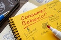 Consumer behavior inscription on the yellow page and marks. Royalty Free Stock Photo