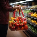 Consumer holding supermarket plastic bag filled with fruits for better quality of life Royalty Free Stock Photo