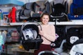 consumer with infant's car cradle Royalty Free Stock Photo