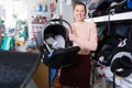 consumer with infant's car cradle Royalty Free Stock Photo