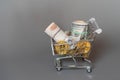 Shopping cart full of money dollar bitcoin rouble