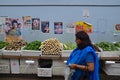 A consumer purchasing fresh produce passing by a long table full of vegetables Royalty Free Stock Photo