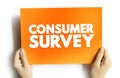CONSUMER SURVEY text on card held by hands. Research and marketing concept, feedback collection and data analysis tool for Royalty Free Stock Photo