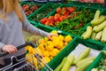 Consumerism concept. Woman doing grocery shopping at supermarket