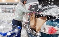 Customer loading food from shopping cart to car Royalty Free Stock Photo