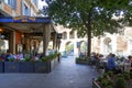 Consumers and tourists relaxing at famous Harry`s Bar in Via Ven