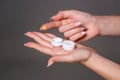 Contact eye lens. Close-up of woman hands holding white eyelense container. Royalty Free Stock Photo