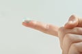 Contact Eye Lenses. Woman Hands With Natural Nails Holding Contact Eye Lens. Closeup Of Girl Finger With Transparent Royalty Free Stock Photo