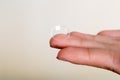 Contact lens on finger on gray background Royalty Free Stock Photo