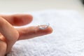 Contact lense on finger to correct nearsightedness and blurred vision eyesight by optician or oculist is to handle with hygiene Royalty Free Stock Photo