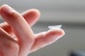 Contact lense on finger to correct nearsightedness and blurred vision eyesight by optician or oculist is to handle with hygiene Royalty Free Stock Photo