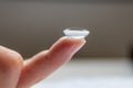 Contact lense on finger to correct nearsightedness and blurred vision eyesight by optician or oculist is to handle with hygiene Royalty Free Stock Photo