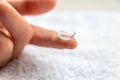 Contact lense on finger to correct nearsightedness and blurred vision eyesight by optician or oculist is to handle with hygiene Royalty Free Stock Photo