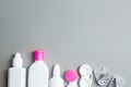 Contact lenses and accessories flat lay on a gray background. Composition with solution bottles and lens case Royalty Free Stock Photo