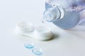 Contact lenses, case and bottle with solution on white background. Eye health and care, eyesight and vision, ophthalmology and Royalty Free Stock Photo