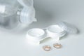 Contact lenses, case and bottle with solution on white background. Eye health and care. Selective focus Royalty Free Stock Photo