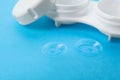 Contact lenses and case on light blue background, closeup Royalty Free Stock Photo