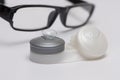 Contact lenses on case and optical glasses