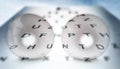Contact lenses on the eye chart background Royalty Free Stock Photo
