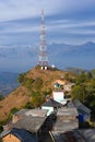 Contact mobile tower at high hilly village of Ashapuri in Himachal Pradesh, India with snow mountains in the backdrop