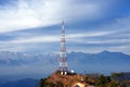 Contact mobile tower at high hilly village of Ashapuri in Himachal Pradesh, India with snow mountains in the backdrop