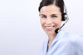 Contact us, customer service operator woman with headset smiling Royalty Free Stock Photo